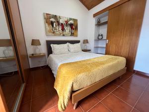 Ένα ή περισσότερα κρεβάτια σε δωμάτιο στο Quintinha da Chinela