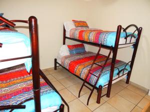 Una cama o camas en una habitación de Casa Catrina 35 fotos más