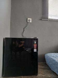Ένα ή περισσότερα κρεβάτια σε δωμάτιο στο Penginapan pondok Tojang