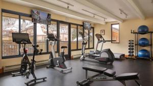 a gym with several treadmills and exercise bikes at The Landmark in Vail +23 photos
