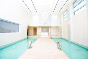 a swimming pool in a building with a swimming pool at Two Bedroom Condo at One Cable Beach with Patio in Nassau