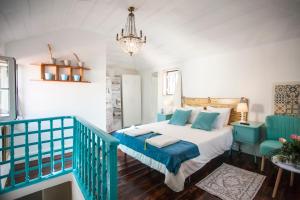 Ένα ή περισσότερα κρεβάτια σε δωμάτιο στο Lisbon Inn Bica Suites