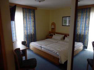 En eller flere senge i et værelse på Landgasthof & Hotel "Zum Schwan" GmbH