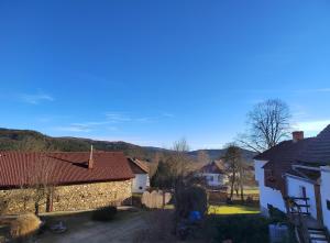 a view of a yard with houses and trees at Apartmán Kristian in Ktiš