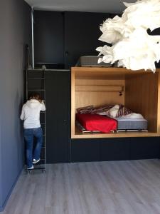 a person is climbing into a bunk bed at Ô51 in Marseille