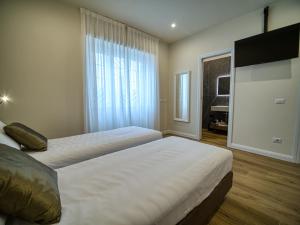 Postel nebo postele na pokoji v ubytování Gioia Guest House