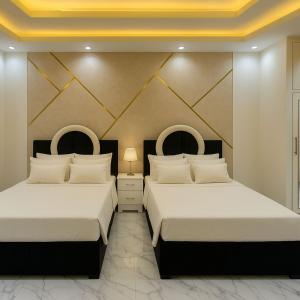 A bed or beds in a room at Porto Said Tourist Resort Luxury Hotel Apartment