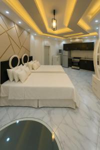 A bed or beds in a room at Porto Said Tourist Resort Luxury Hotel Apartment