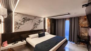 Postel nebo postele na pokoji v ubytování Hotel Bacatá Isla