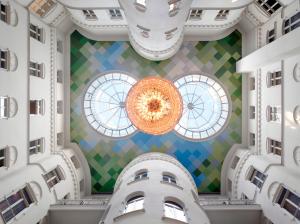 a large building with a large clock on the ceiling at Nobis Hotel Stockholm, a Member of Design Hotels™ in Stockholm
