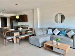 a living room with a couch and a table at Puertarena in Nuevo Vallarta