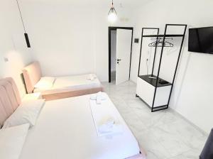 Postel nebo postele na pokoji v ubytování Sunset Hotel