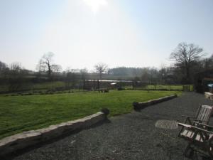 a park with a picnic table and a grass field at Les Puvinieres in Breuil-Barret