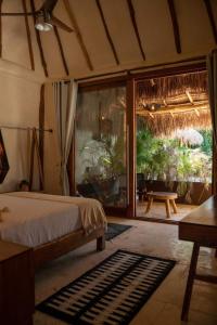 Katil atau katil-katil dalam bilik di Kasa Uh May-Tulum