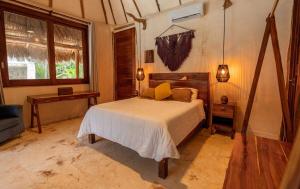 Katil atau katil-katil dalam bilik di Kasa Uh May-Tulum +130 gambar