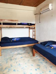 Postel nebo postele na pokoji v ubytování Cabaña Alojamiento Valhalla