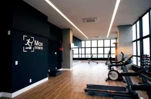 a gym with a treadmill and a bike in a room at Flat no Coração do Recife Próximo ao Consulado Americano in Recife
