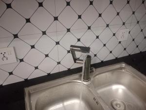 a sink with a faucet in a bathroom at Bahria town karachi Ali block in Karachi
