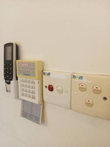 a nintendo wii game system with a remote control at Elsa Tawau homestay near Airport in Tawau
