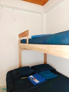 Postel nebo postele na pokoji v ubytování Cabaña Alojamiento Valhalla