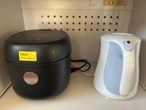 a toaster and a toaster sitting on a counter at 恩納ゆんたく-SEVEN Hotels and Resorts- in Onna