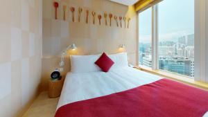 Uma cama ou camas num quarto em Hotel Madera Hong Kong