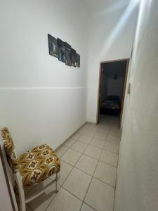 a small room with a chair and a hallway at Alojamiento CENTRICO 1 in Villa María