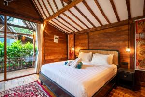 Ένα ή περισσότερα κρεβάτια σε δωμάτιο στο Kadewa Retreat Ubud - Adults Only +94 φωτογραφίες