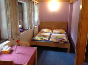 Ein Bett oder Betten in einem Zimmer der Unterkunft Penzion Ida
