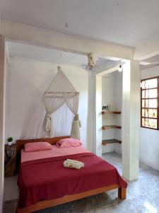 Postel nebo postele na pokoji v ubytování Bali Bungalow Medewisurf-homestay + 15 fotografií