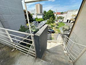 a set of stairs leading up to a building at Elegant 2 Bedroom Apartment with Free Parking Paris St-Denis by Immo Kit BNB in Saint-Denis