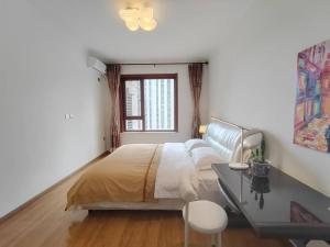 Postel nebo postele na pokoji v ubytování 中央大街高级公寓 + 37 fotografií