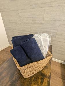 a basket of towels sitting on top of a table at -Summer Escape- Just 15 min from Haneda Airport, Max 3 in Tokyo +20 photos