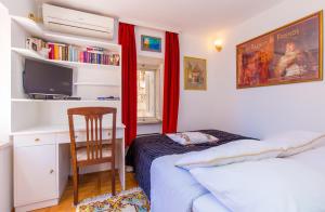 TV a/nebo společenská místnost v ubytování Holiday Home Piccolo Mondo