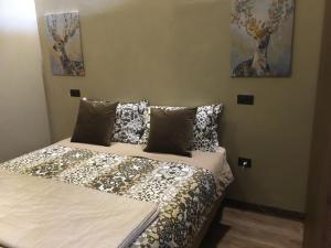 A bed or beds in a room at Corte degli Angeli Agriturismo