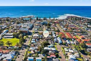 an aerial view of a suburb with a hot air balloon at Townhouse in Shellharbour Village in Shellharbour