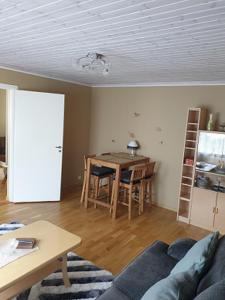 a living room with a couch and a table at Kuressaare Centrum in Kuressaare