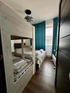 En eller flere senge i et værelse på Таунхаус в пансионате байтур