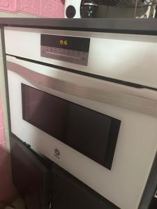 a oven with a clock on the front of it at Apartamento Deluxe city in Burgos