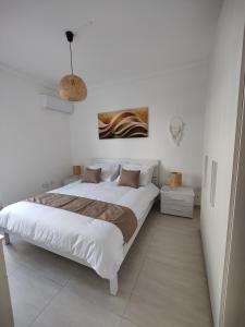 Voodi või voodid majutusasutuse Marsaxlokk 2BR Apartment - Quiet Coastal Escape toas