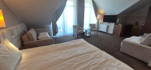 Postel nebo postele na pokoji v ubytování Hotel White