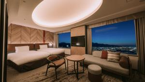 Ένα ή περισσότερα κρεβάτια σε δωμάτιο στο Sapporo Prince Hotel