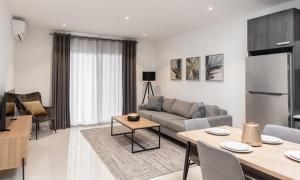 a living room with a couch and a table at Ultramodern 2 bedroom space Available in Accra