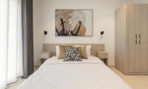 a bedroom with a large white bed with a pillow at Luxurious King Suite Two Bedroom Space Available in Accra