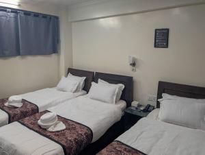 Voodi või voodid majutusasutuse Apartment Hotel 11 Thamel toas