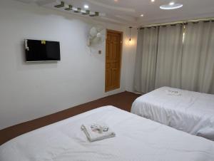 Comfort Hotel & Huts客房内的一张或多张床位