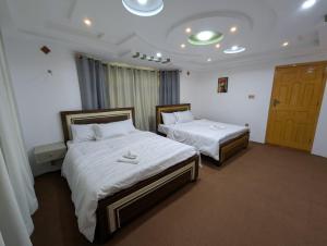 Comfort Hotel & Huts客房内的一张或多张床位