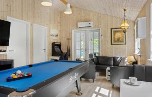 a living room with a pool table at Holiday Home Ajstrup Strandvej Malling Xi in Malling