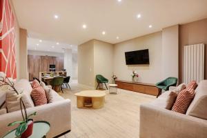 Televízia a/alebo spoločenská miestnosť v ubytovaní Spacious apartment - 4BR-15P - Sentier-Grand Rex
