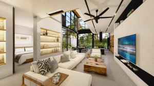 a living room with white furniture and a large tv at Seis E Villa 4 Bedroom In Canggu in Badung